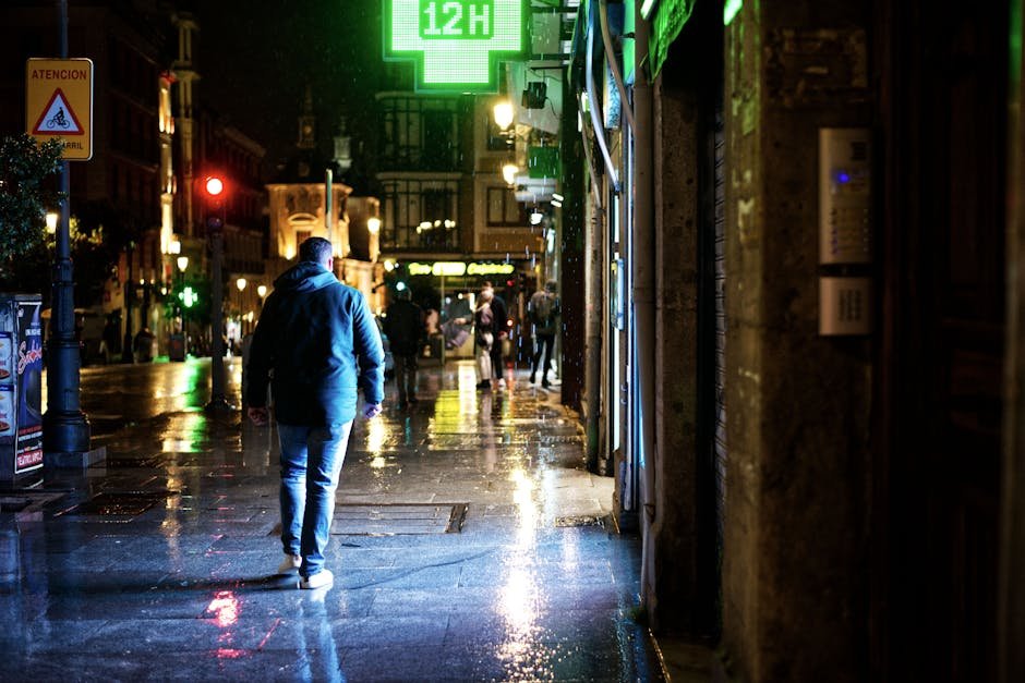 Single neon sign reading OPEN reflected in a rain-wet sidewalk at night, the late-shift Brooklyn vibe that frames the closing notes of any serious anora review