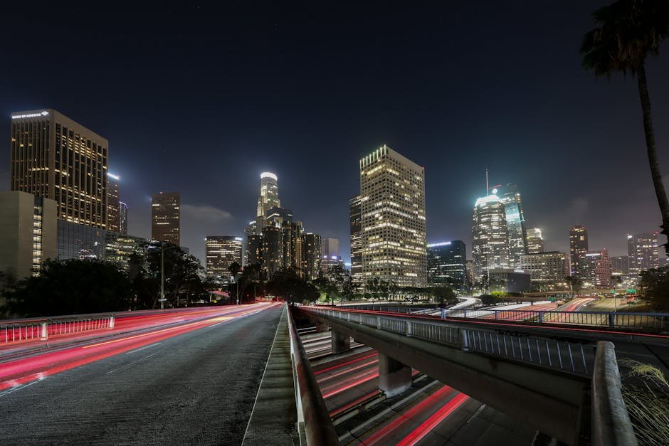 Sodium-vapor streetlights over a quiet city avenue at night, the Los Angeles lensing palette this heat 1995 review keeps returning to