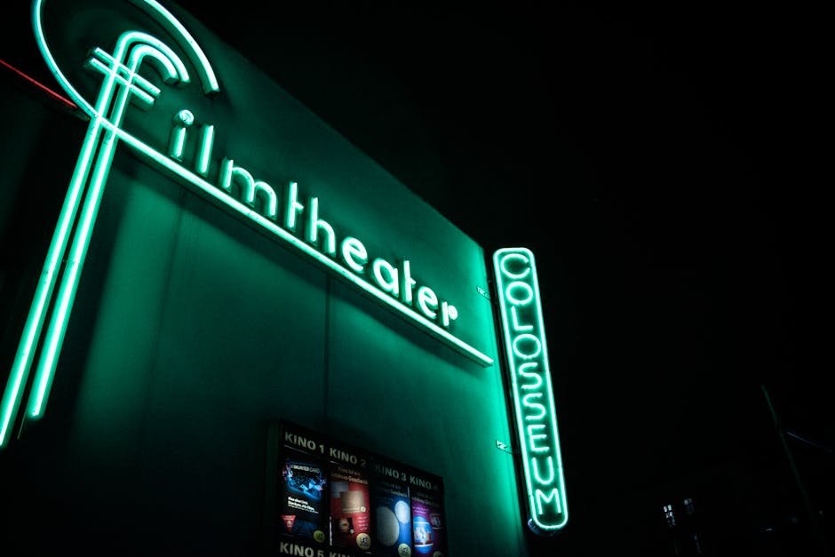 Single beam of light cutting through a darkened theater toward the screen, the kind of focused attention this Conclave review argues the film actually rewards
